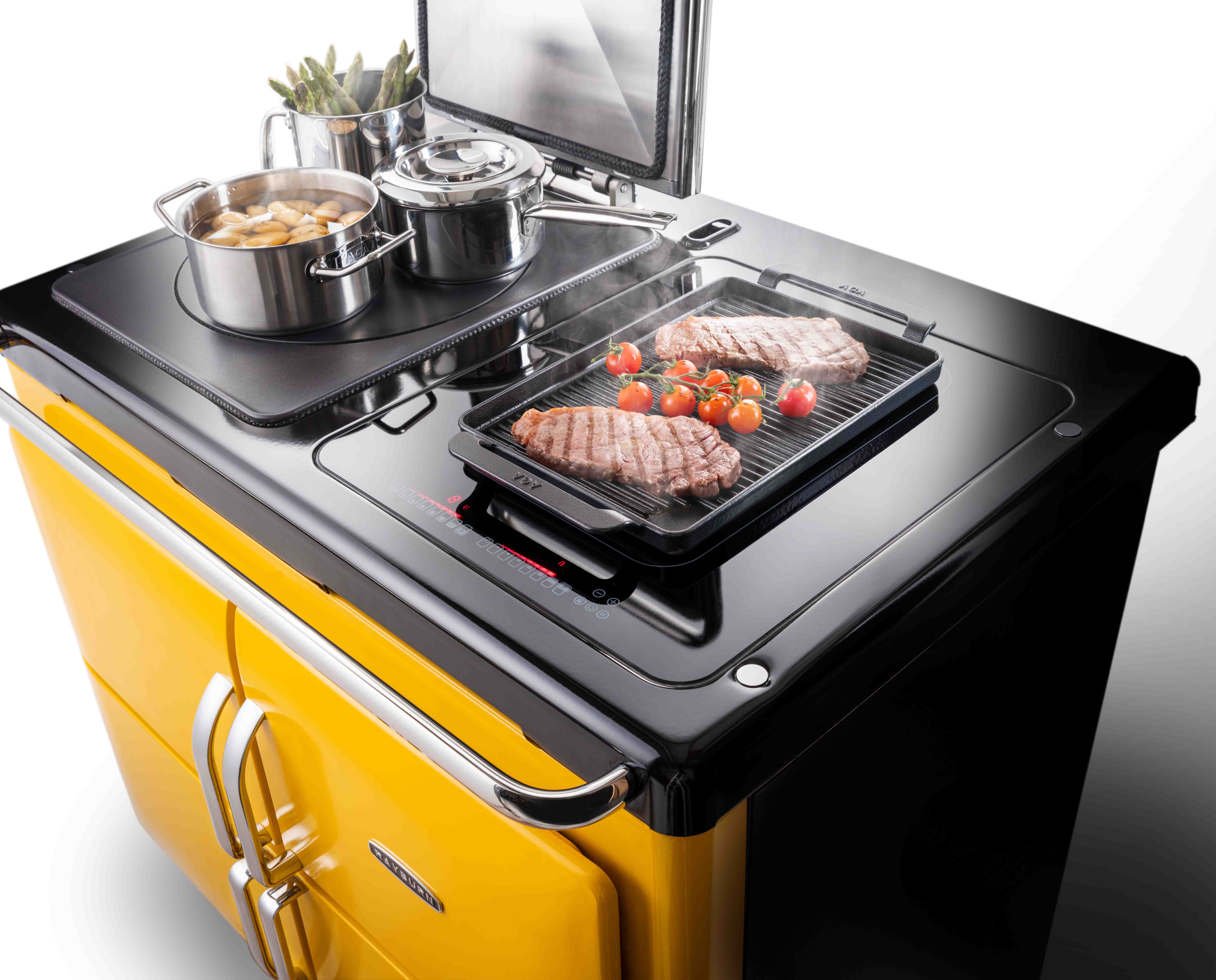 Rayburn Ranger hob top with cast-iron hotplate and induction hob cooking steak