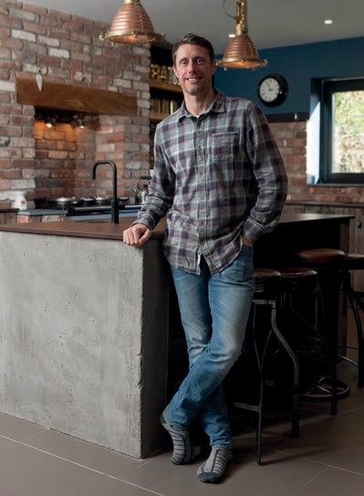 Graham in front of kitchen island