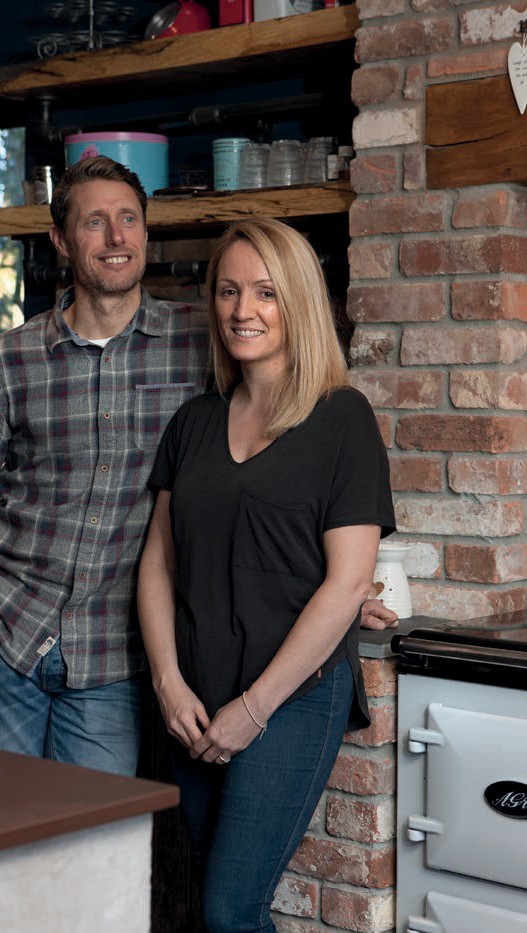Graham and Emma with their self-built kitchen in Devon