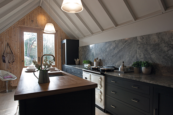 AGA Dual Control in White surrounded by black cabinetry 