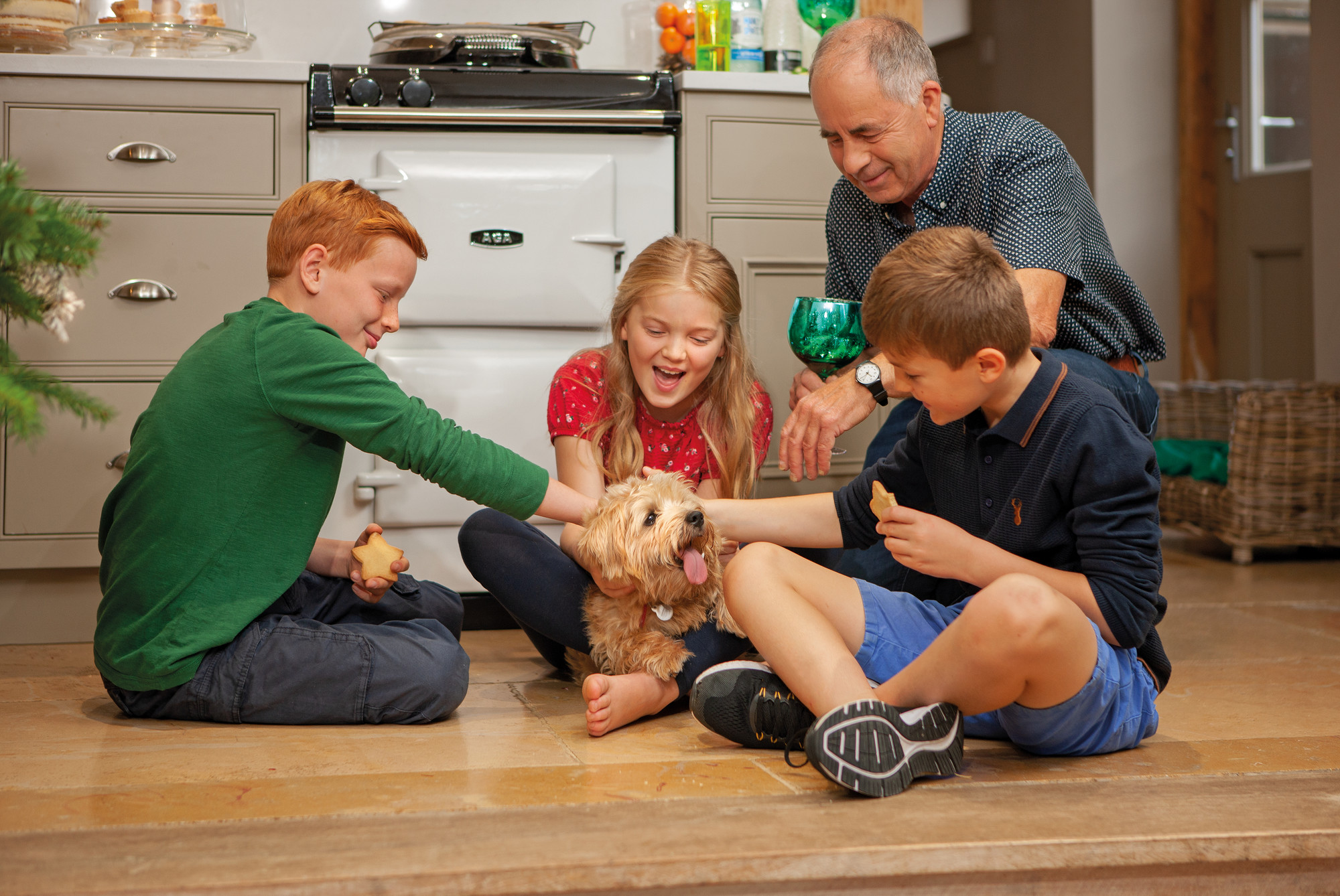 Family in Kitchen with Dog