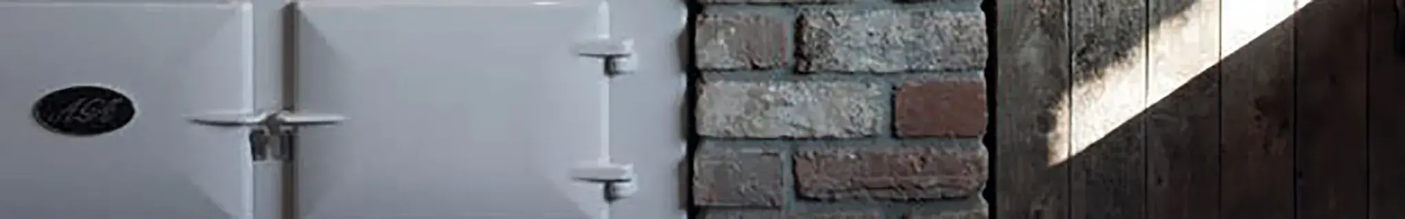 AGA cooker against brick wall