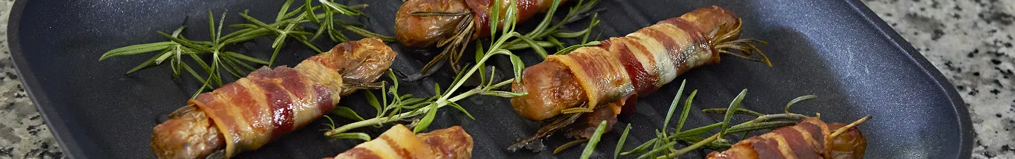 Sausages wrapped in bacon 