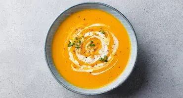 Orange soup in a bowl 