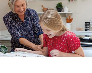 Grandmother and daughter cooking 