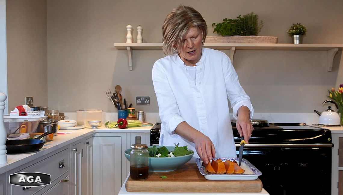 Na Hansell making a butternut squash salad with feta and spinach 