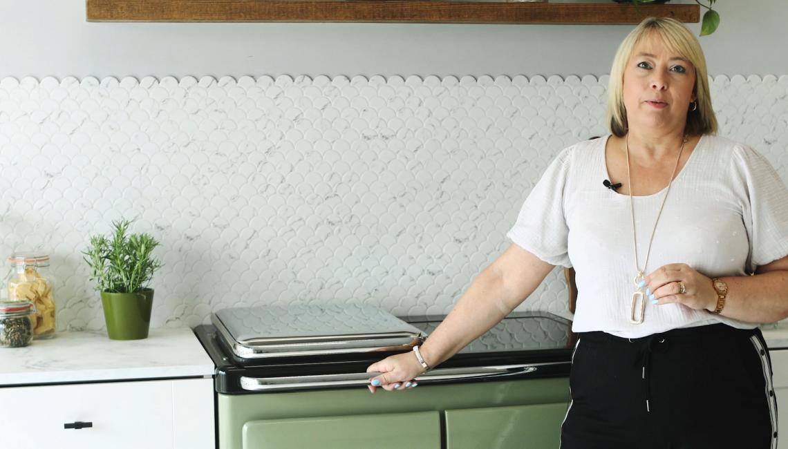 AGA Demonstrator Penny Zako with the Rayburn Ranger cooker in Olivine