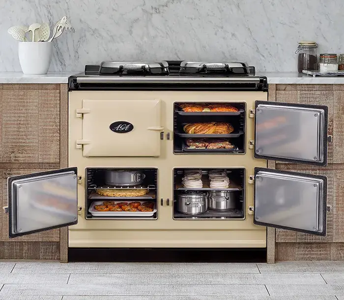 Open AGA filled with essential AGA cookware