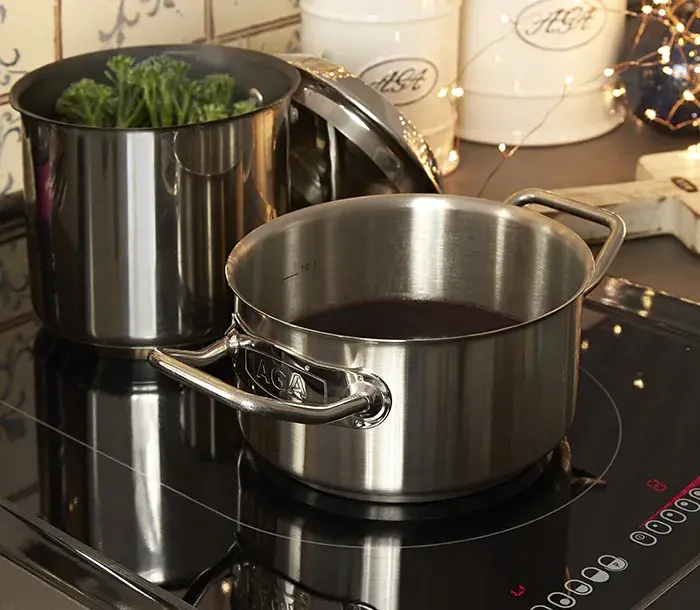 Gravy cooking in the stainless steel pans