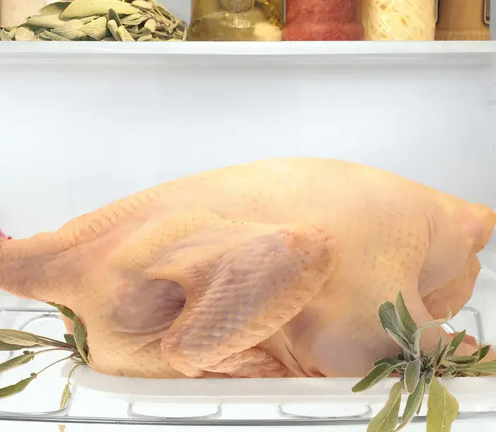 Raw turkey defrosting in the refrigerator 