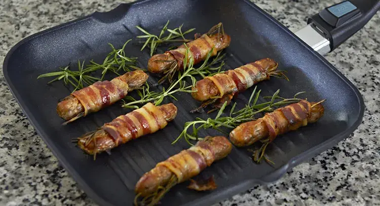 Sausages wrapped in bacon 