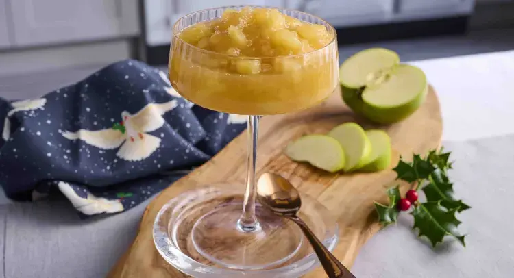 Cider and apple sauce in a wine glass