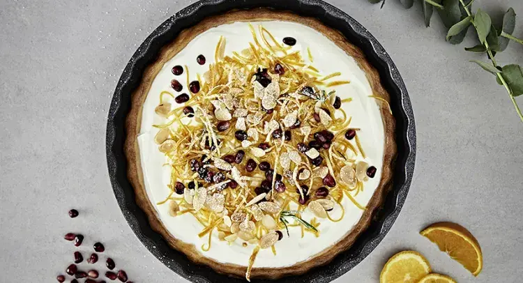 Baked Vanilla Cheesecake with Crystallised Orange and Pomegranate Seeds